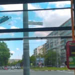 a view of a street from inside a bus