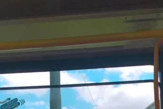 a view of a street from inside a bus