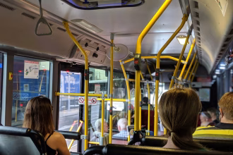 people sitting down inside vehicle