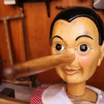 selective focus photography of Pinocchio puppet